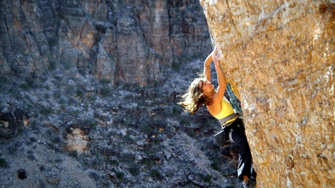 women rock climbing photo