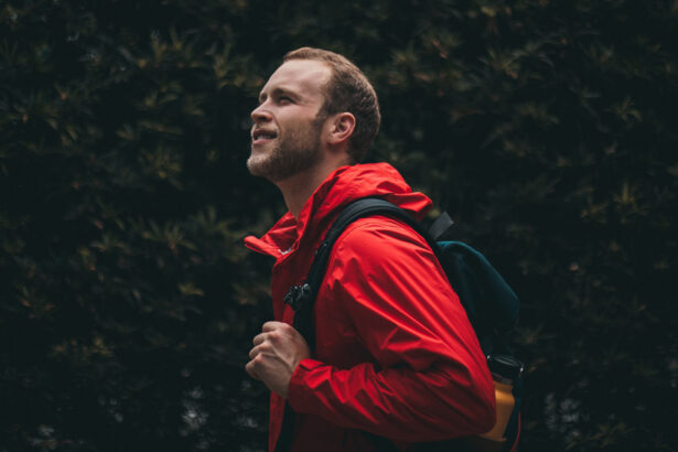 Man in the forest wearing a hard shell jacket