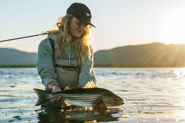 Woman who just caught a striped bass