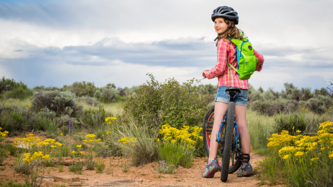 Little girl outside on a bike