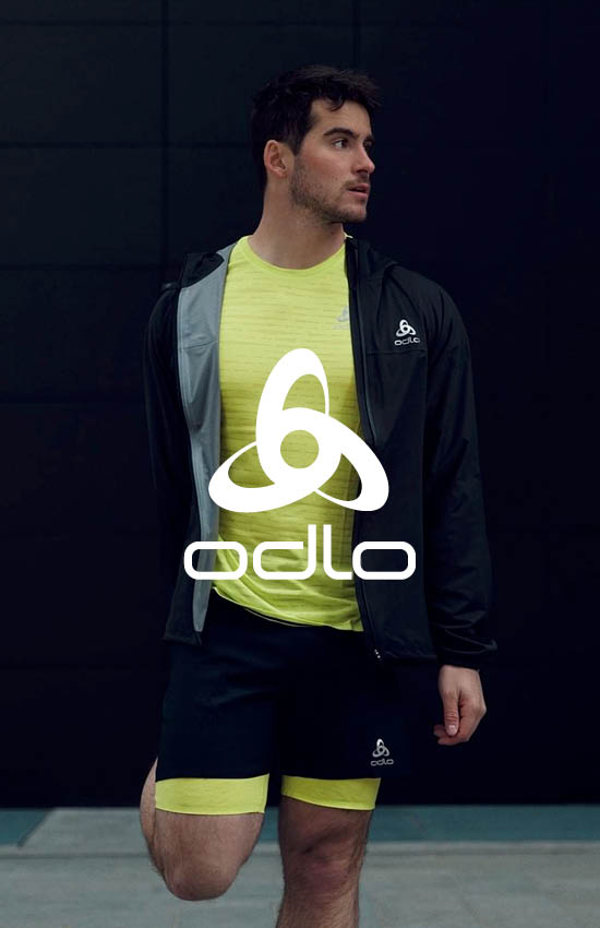 Man stretching and wearing Odlo activewear 