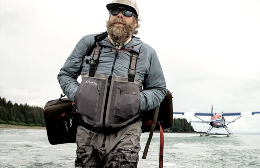 A man equipped to go fishing no matter what the weather