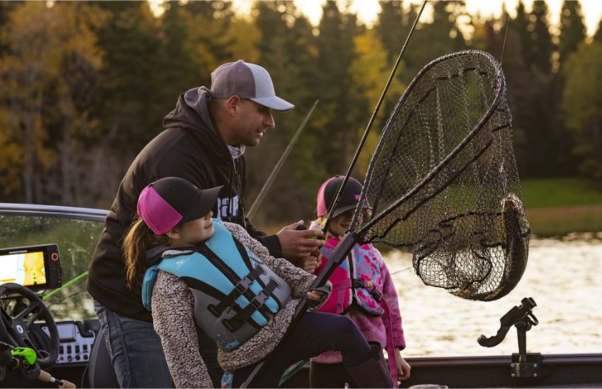 A father with his children fishing for walleye