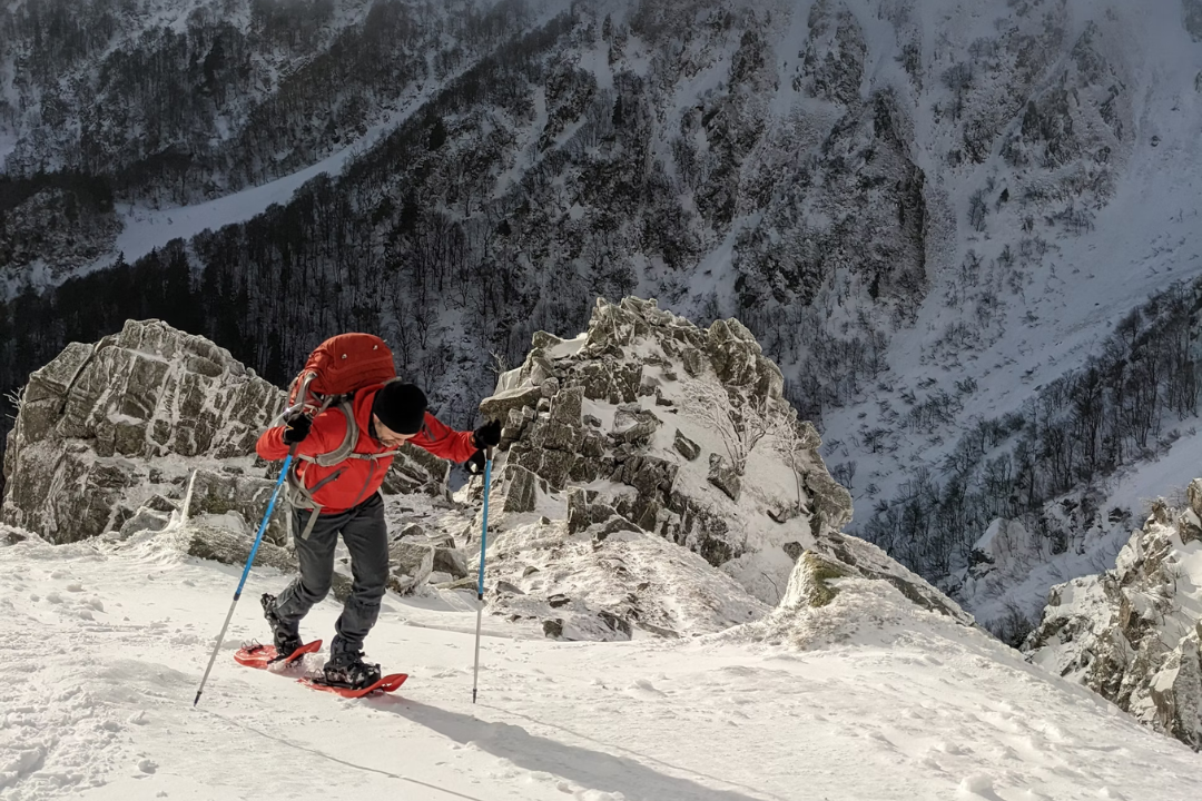 Winter snowshoe hiking in montain