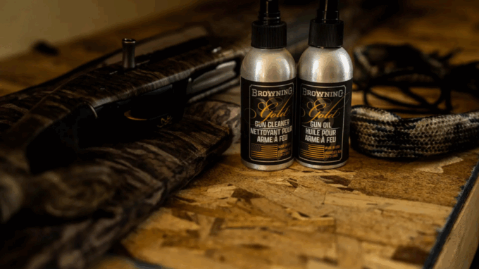 Hunting firearm with Browning cleaning products and tools (cleaner, gun oil, bore snake).